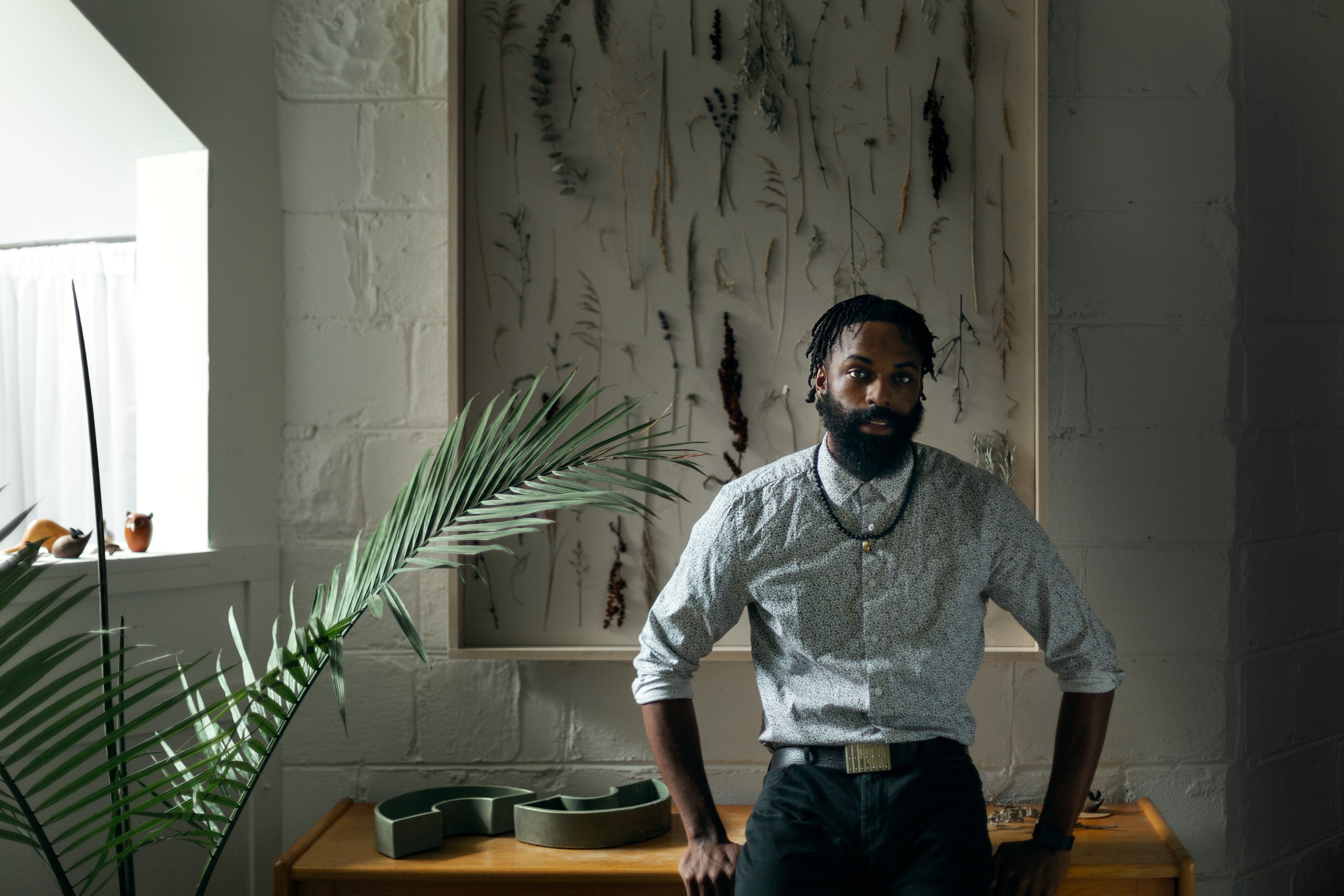 files/man-rests-against-wooden-table.jpg